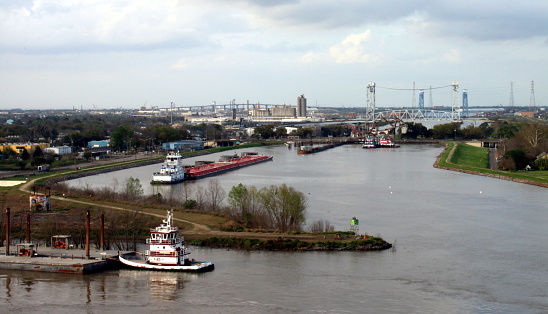 Tugboats and barges operate in the busy port of New Orleans.