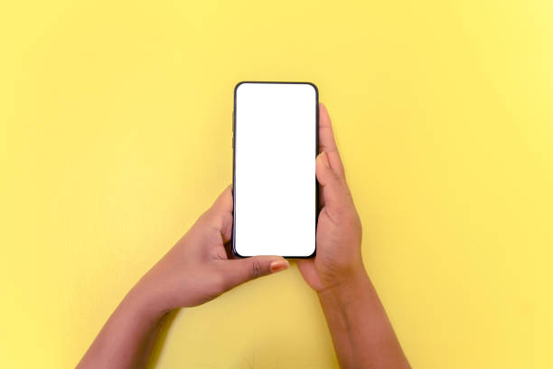 istock Human hand holding smartphone with white screen background. 1136925789
