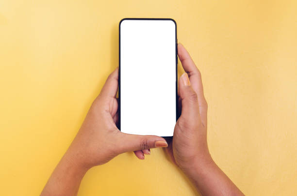 istock Human hand holding smartphone with white screen background. 1136925968