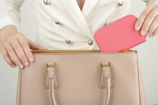 istock a scene of putting a wallet in a bag 1136930023