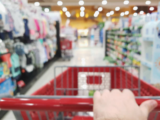 istock Hand pushing shopping cart 1136930372