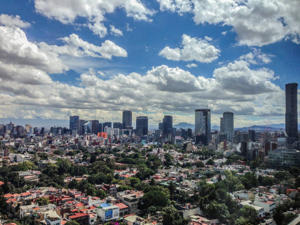 Mexico City panoramic view from observation deck in Polanco, main Paseo de la Reforma (Reforma Ave) buildings can be identified on a sunny day with beautiful clouds at noon on October 23, 2015