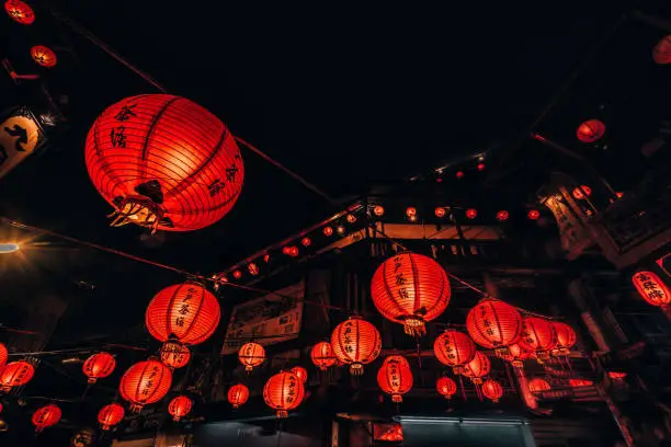 Beautiful lit orange lanterns on the Old Street of Jiufen, Taiwan.  Asia

Translation:  Tea House