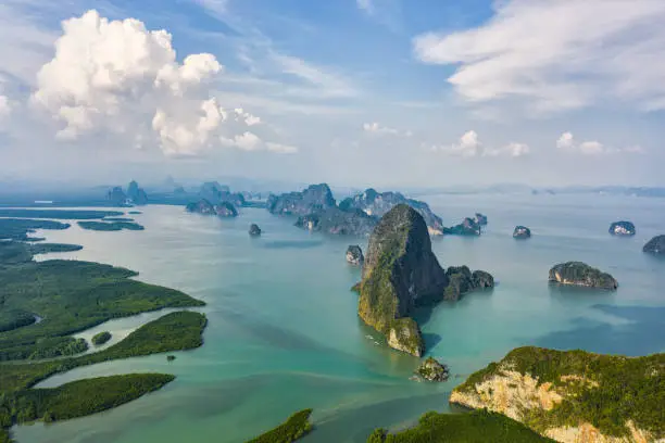View from above, aerial view of the beautiful Phang Nga Bay (Ao Phang Nga National Park) with the sheer limestone karsts that jut vertically out of the emerald-green water, Thailand.