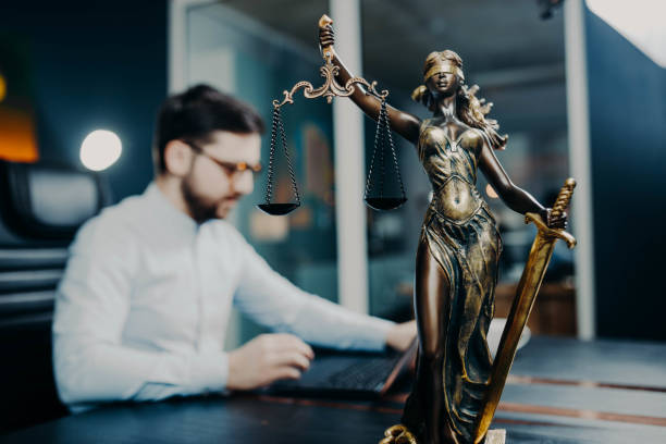 concept of law and justice, scales of justice. Young male lawyer, attorney, office judge stock photo