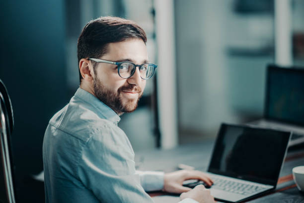 istock bearded trendy modern business man at work in office. manager with glasses 1136937592