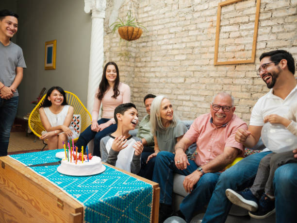 istock Mexican boy with cake on face 1136937791