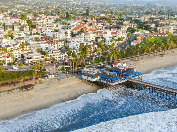 Aerial view of San Clemente Pier with beach and coastline before sunset tim Aerial view of San Clemente Pier with beach and coastline before sunset time. San Clemente city in Orange County, California, USA. Travel destination in the South West Coast. Famous beach for surfer. san clemente california stock pictures, royalty-free photos & images