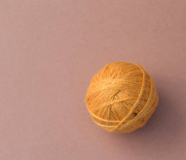 istock tangle of yellow threads on yellow background with copy space 1136945331