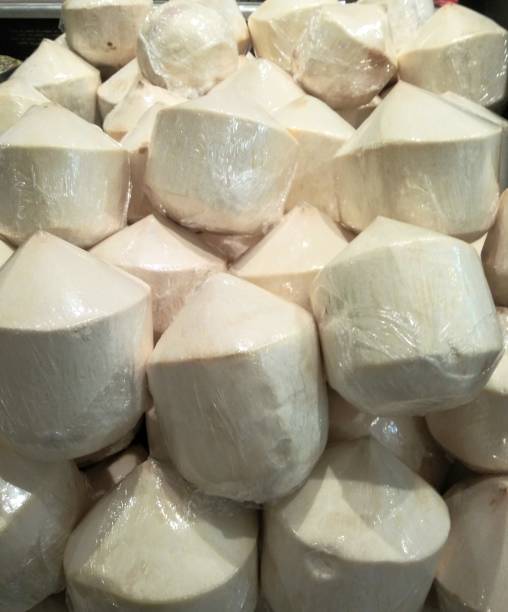 istock Young coconut - retail display at grocery store 1136945363