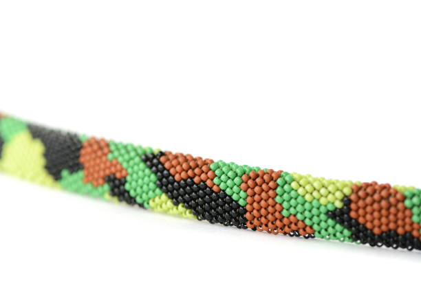 istock Camouflage beaded bracelet isolated on white background close up 1136946170