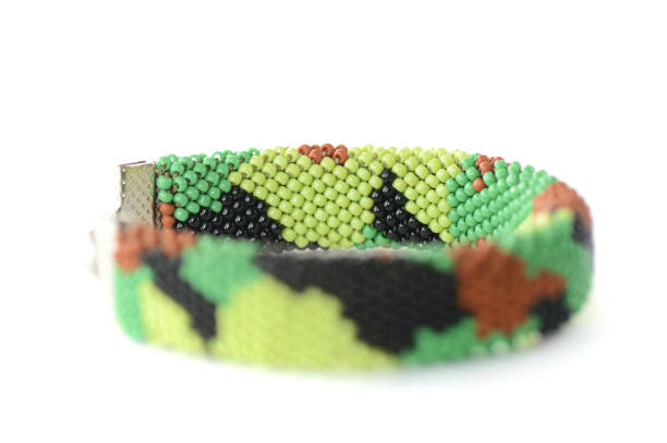 istock Camouflage beaded bracelet isolated on white background close up 1136946176
