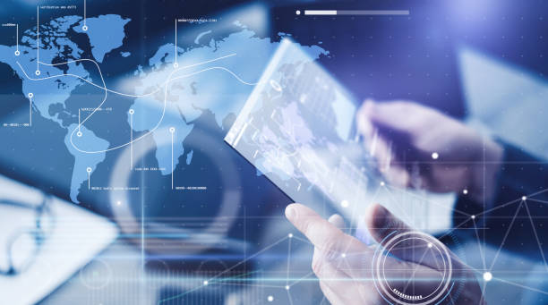 istock Man with futuristic digital tablet on a project 1136948327