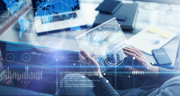 istock Man with futuristic digital tablet on a project 1136948330
