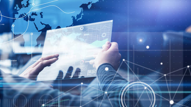 istock Man with futuristic digital tablet on a project 1136948337