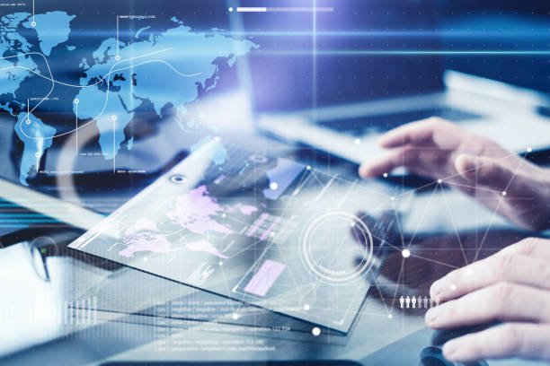 istock Man with futuristic digital tablet on a project 1136948338