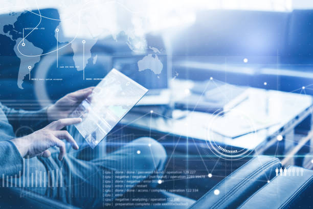 istock Man with futuristic digital tablet on a project 1136948341