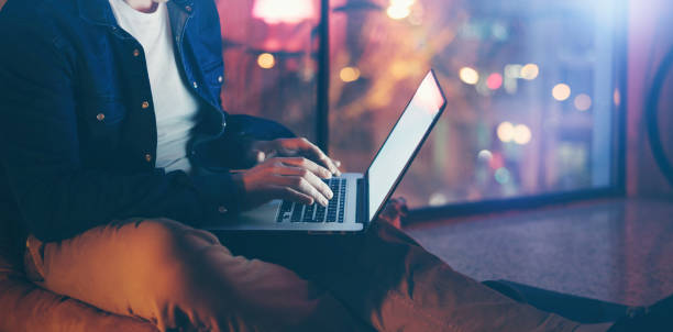 istock Man working on laptop at night 1136948349