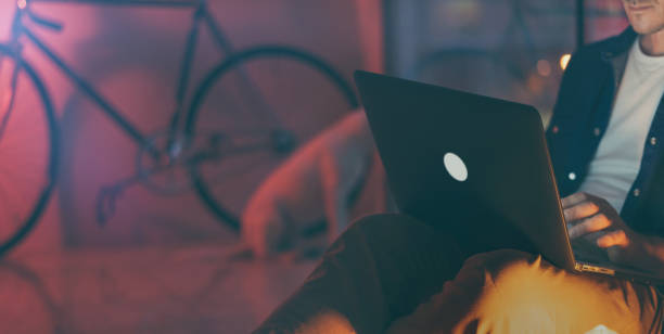 istock Man working on laptop at night 1136948353