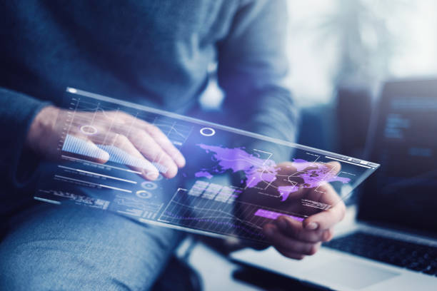 istock Man with futuristic digital tablet 1136949417
