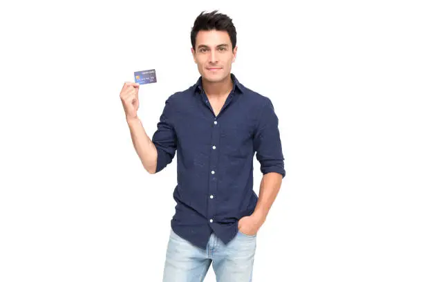 Young handsome Caucasian man smiling, showing, presenting credit card for making payment or paying online business, Pay a merchant or as a cash advance for goods, Cardholder or A person who owns card