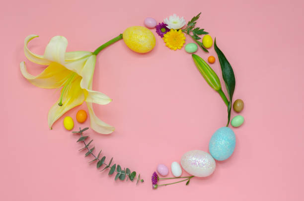 istock Easter circle wreath layout made of colorful glitter eggs. 1136951275