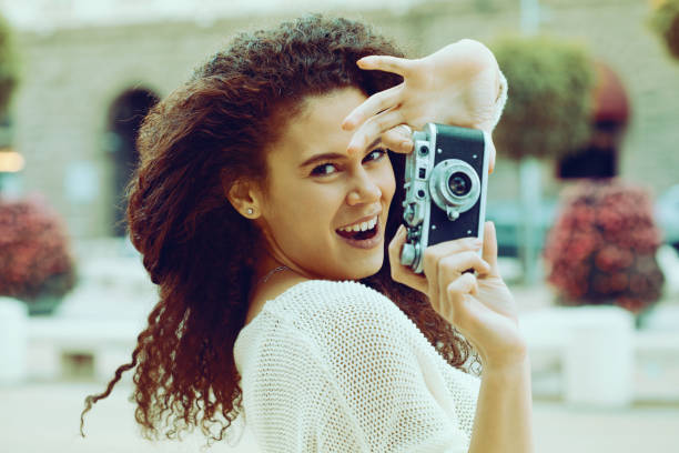 istock Young photographer with a vintage camera 1136951542