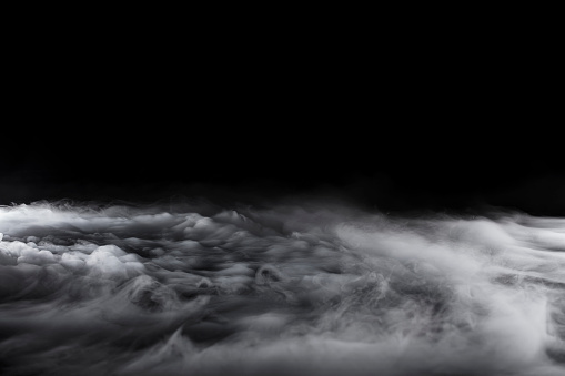 Rolling Dry Ice on Black Background