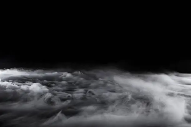 Photo of Rolling Dry Ice on Black Background