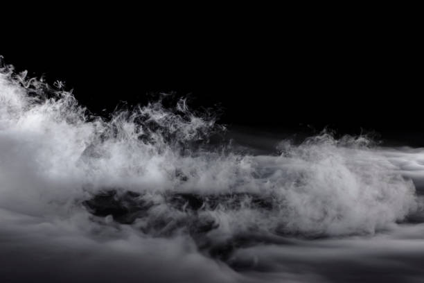istock Rising Blowing Dry Ice on Black Background 1136953359