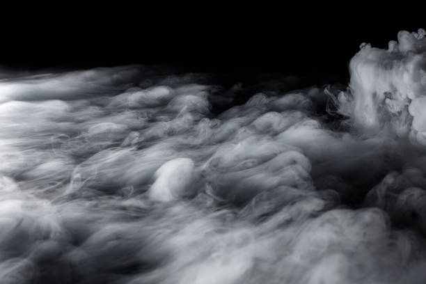 istock Wavy Rolling Clouds of Dry Ice on Black Background 1136953368