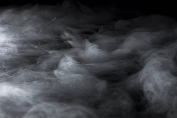 istock Wavy Rolling Clouds of Dry Ice on Black Background 1136953381