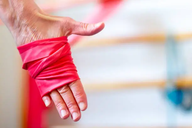 Photo of A woman is stretching with a stretch band