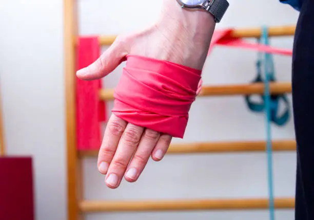 Photo of A woman is stretching with a stretch band