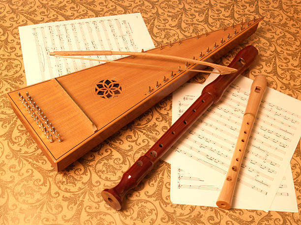 Bowed Psaltery with Recorders on Sheet Music stock photo