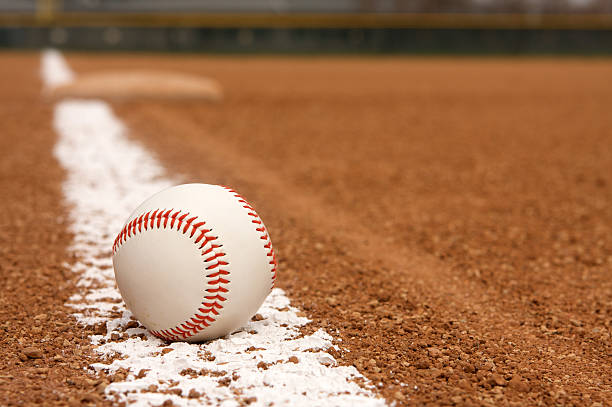 istock Baseball over chalk line of stadium field 113695606