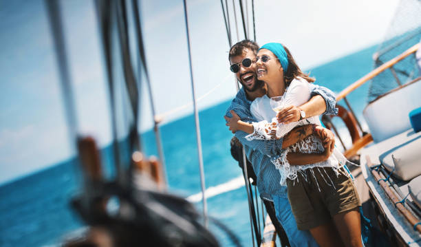 istock Young couple on a sailing cruise. 1136958467