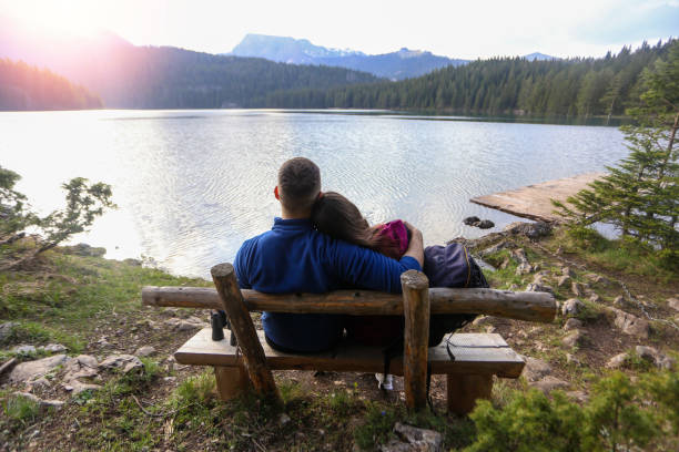 istock Romantic couple enjoying the sunset 1136961704