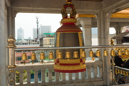 Row of big bells in a Buddhist temple, Thailand.