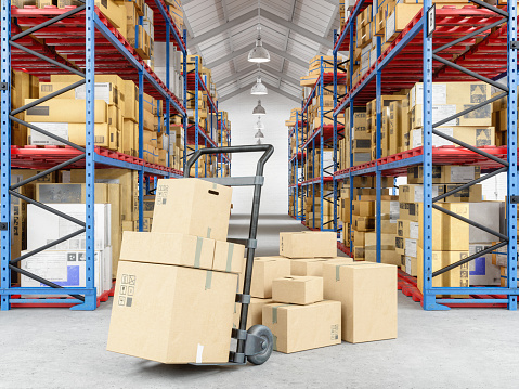 Hand truck and cardboard boxes  in warehouse