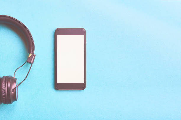 istock Headphones and smartphone on colorful background. 1136972678