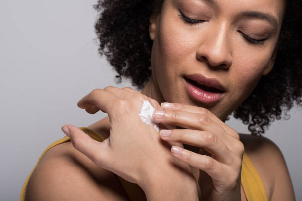 istock Girl applying hand cream 1136972839
