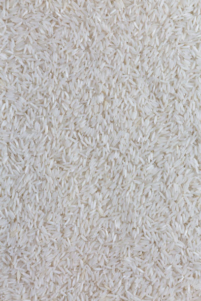 istock Dry white rice basmati background, top view. Flat lay, overhead, from above. 1136974020