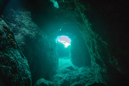 Underwater cave at the sea bottom. Natural cave near Syvota, Greece