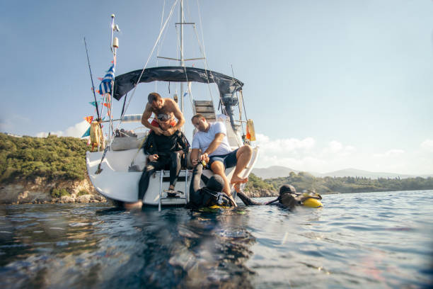 istock People preparing for scuba diving from sailboat 1136975511