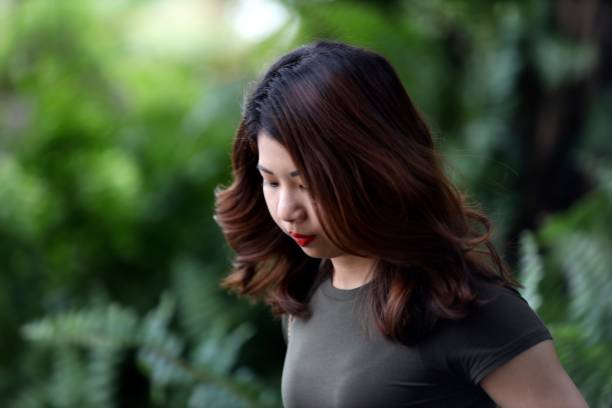 istock Young woman walking at park 1136977127
