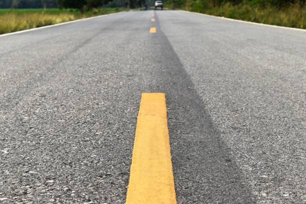 istock old asphalt road in countryside 1136981238
