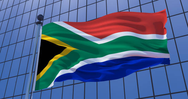 istock South Africa flag on skyscraper building background. 3d illustration 1136984089