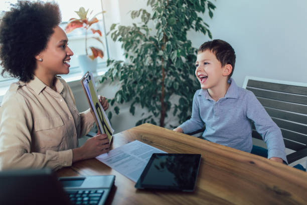 istock Shot of a speech therapist during a session with a little boy 1136984247