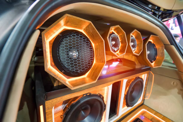 lights of stereo and speakers in car in the night lights of stereo and speakers in car in the night car audio equipment stock pictures, royalty-free photos & images